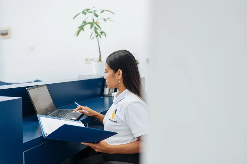 Synergy Pro team member at the front desk